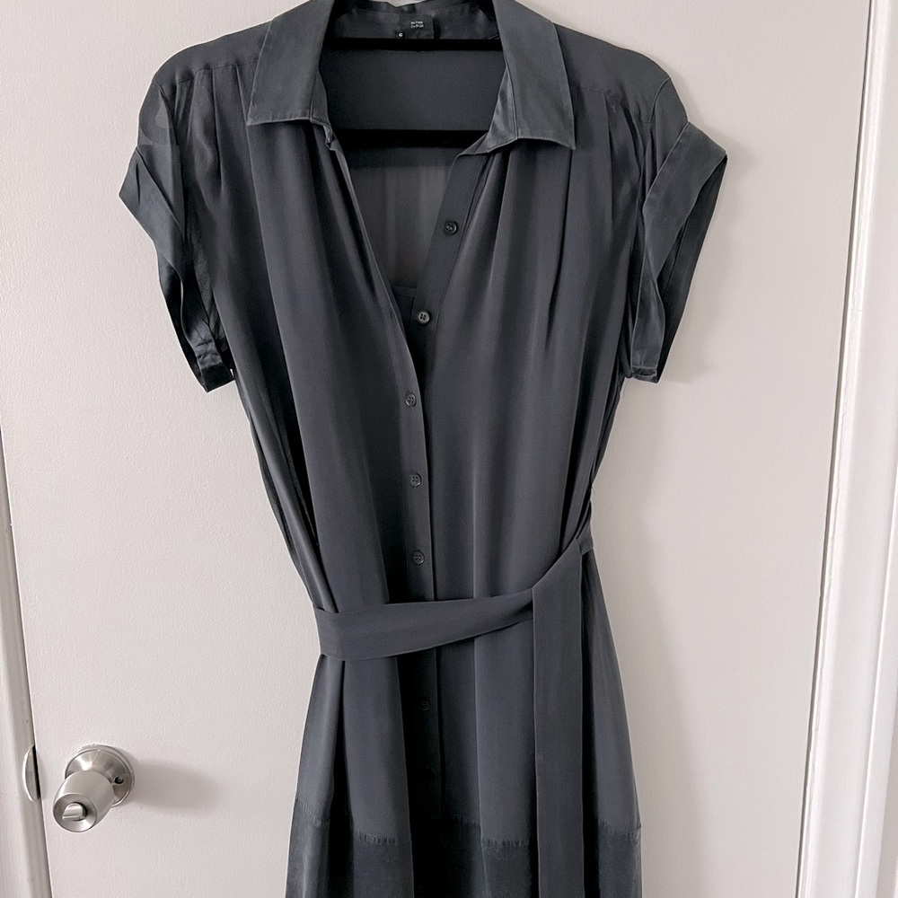 Dark grey belted silk dress.